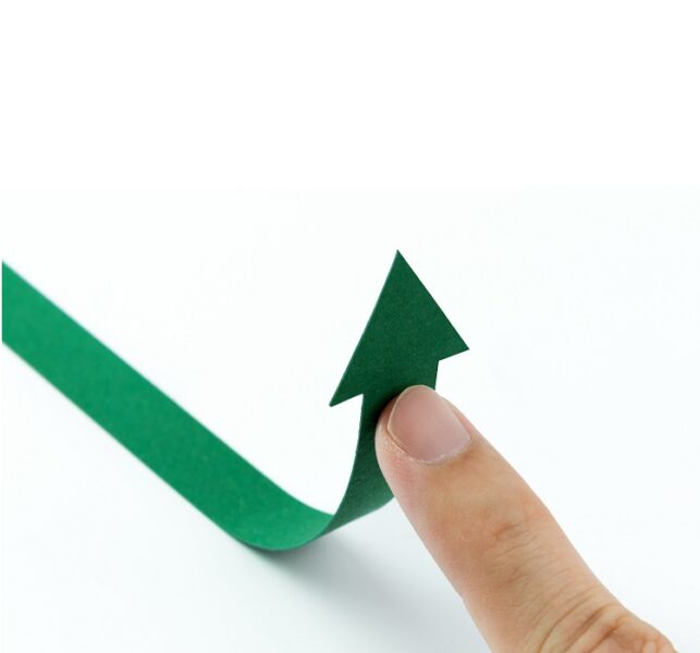 A photograph of an arrow being diverted by a finger