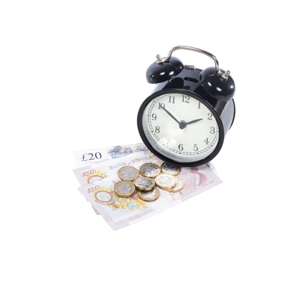 A photo of money and an alarm clock
