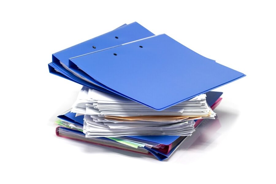 Photograph of pile of case files