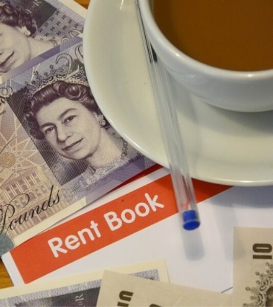 Photograph of rent book and rent money